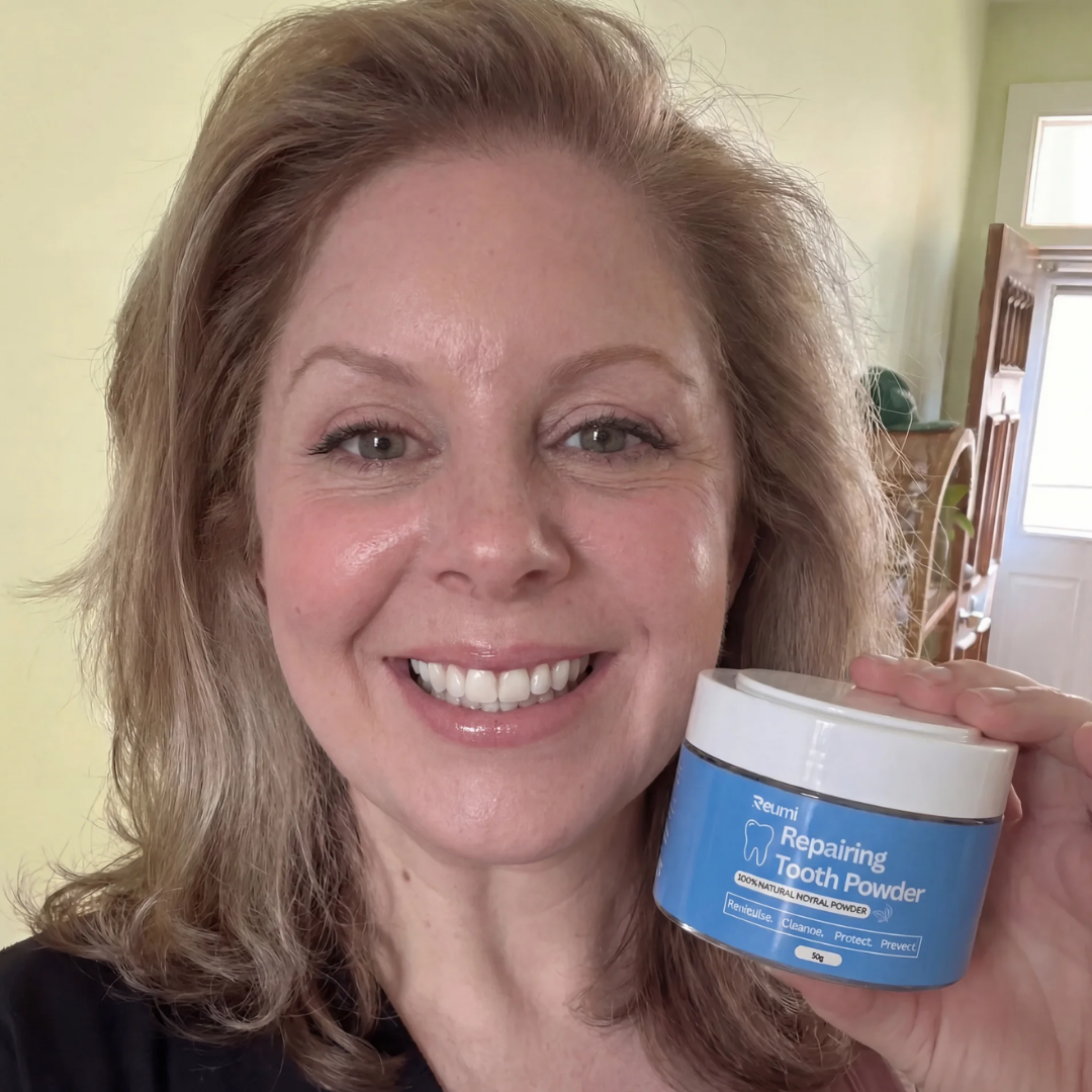 A smiling woman holds up a blue and white jar of Reumi Repairing Tooth Powder.