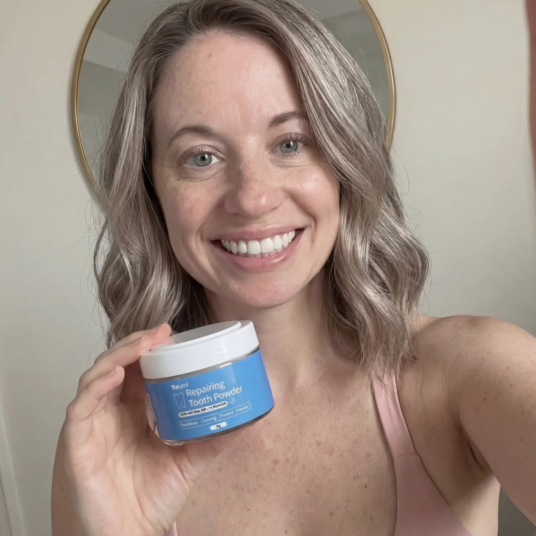 A smiling woman with blonde hair holds up a small jar of Beuml Repairing Tooth Powder.