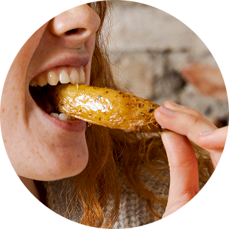 Woman eating a potato