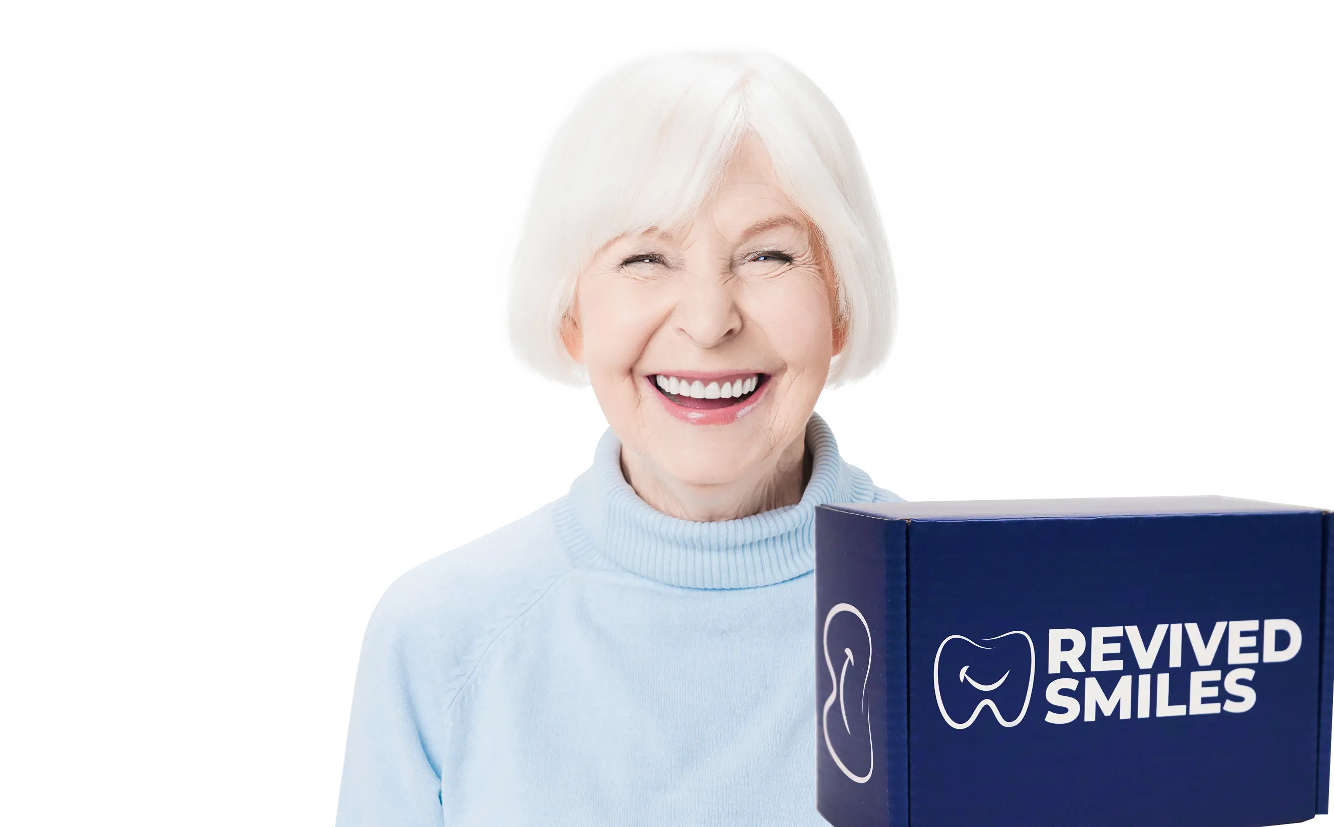 Smiling elderly woman holding a box labeled 'Revived Smiles.'