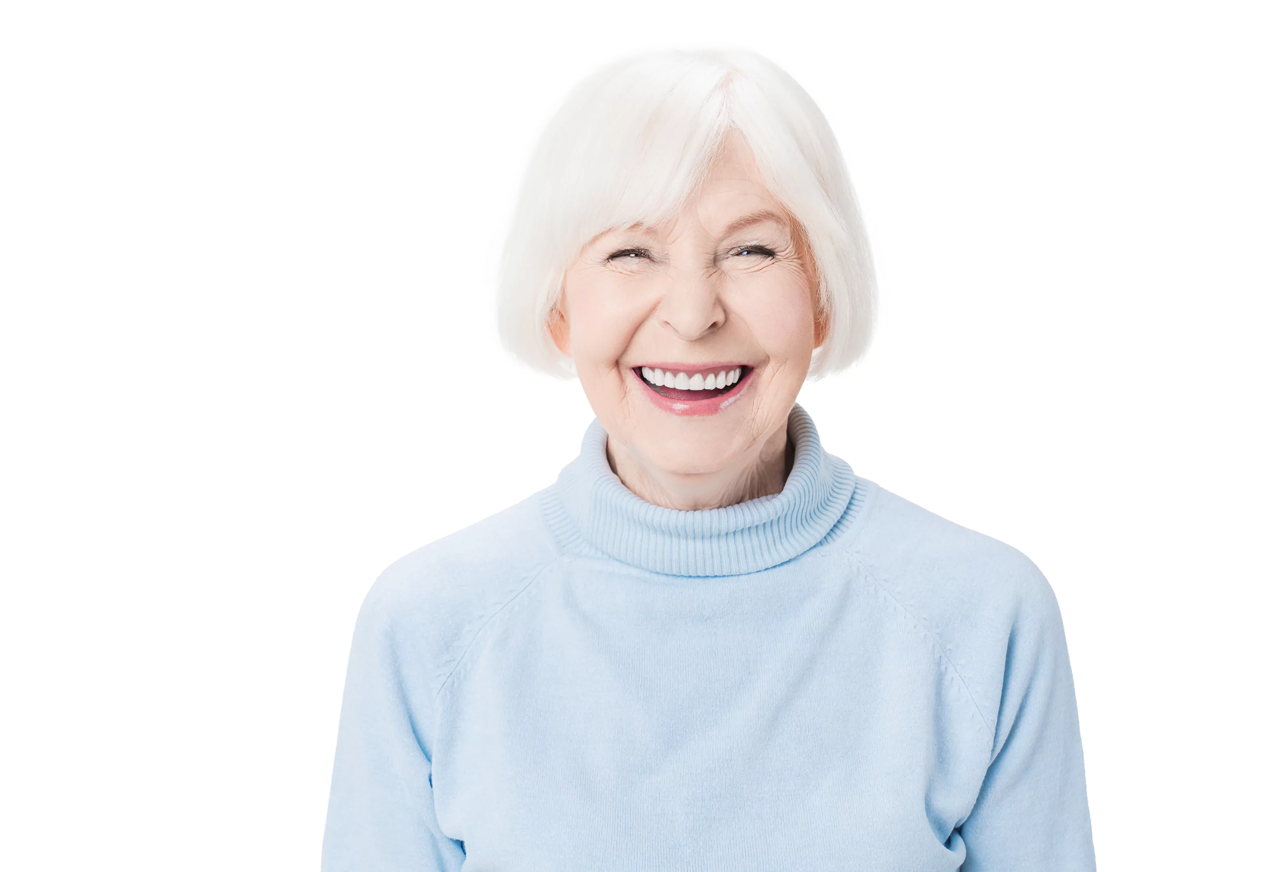 Smiling elderly woman with white hair in a light blue sweater.