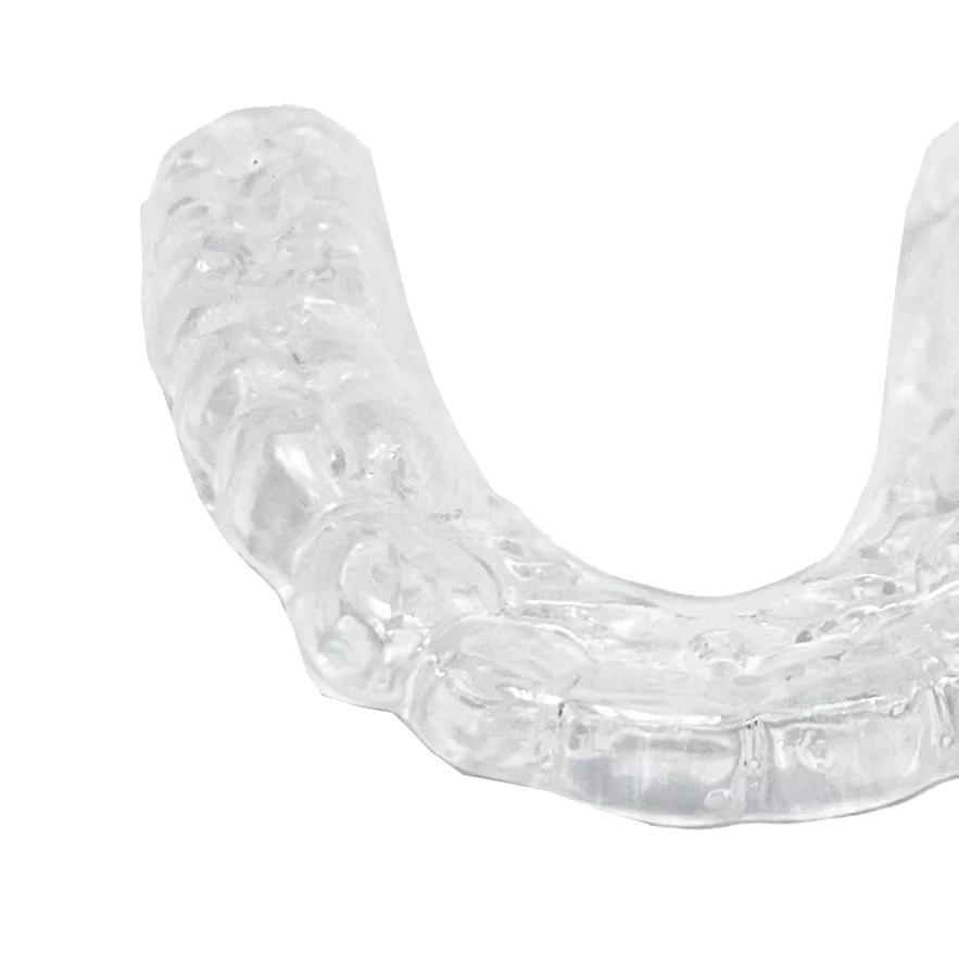Clear dental retainer on a black background.