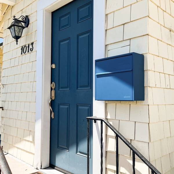 Navy wall mount mailbox in spring