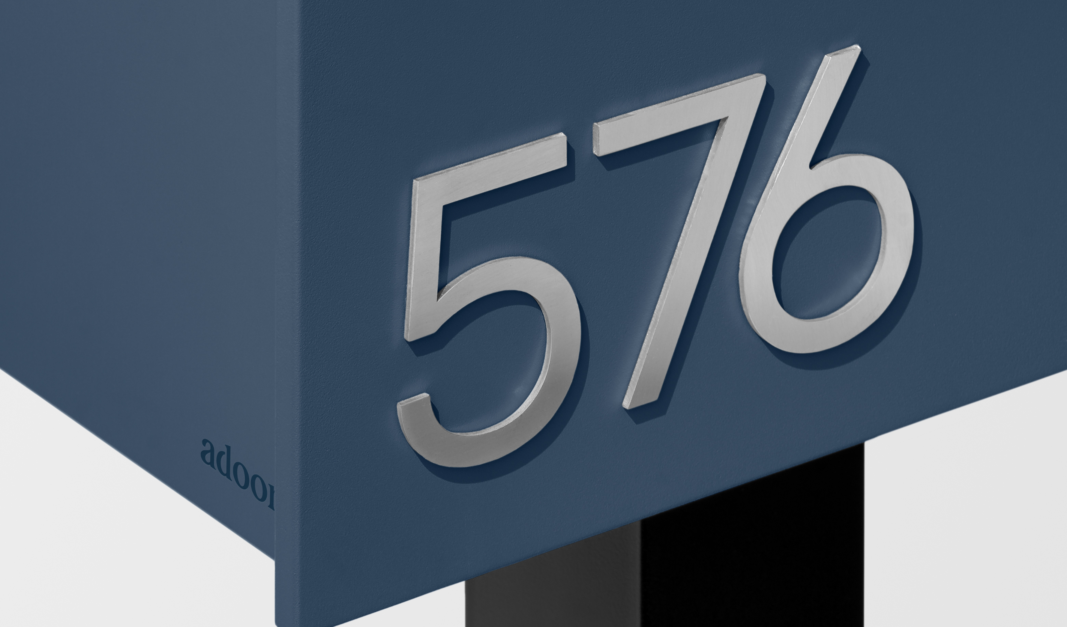 Metallic numbers '576' on a blue block.