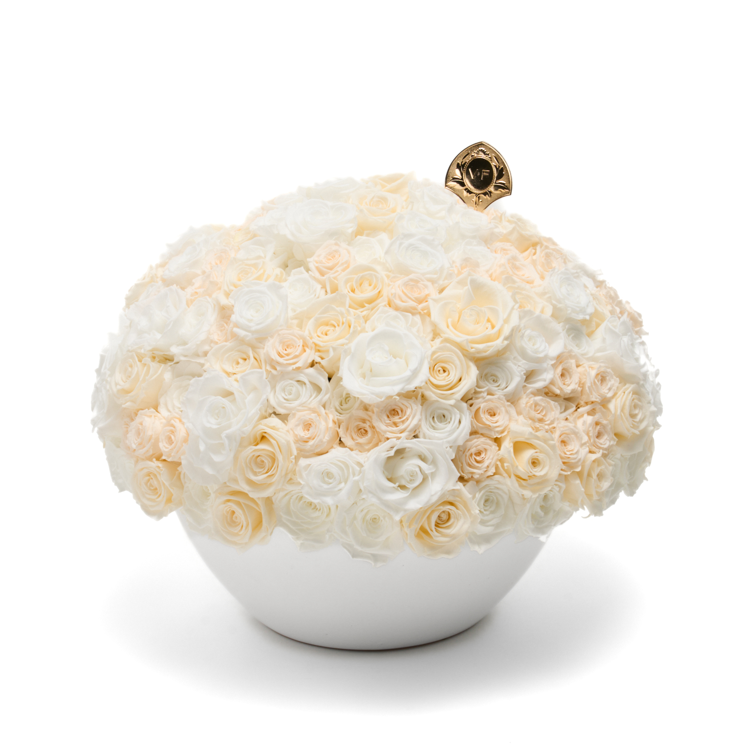 A large, dome-shaped bouquet of pink and white roses in a white branded hat box.