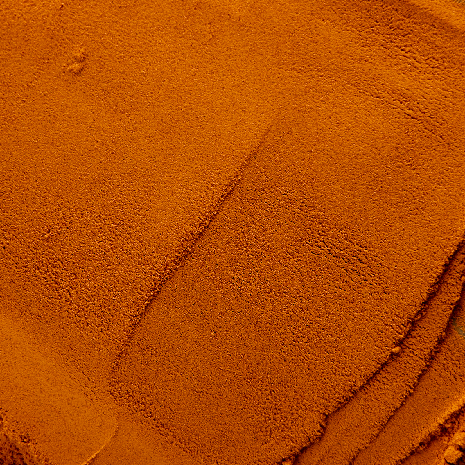 Close-up of a textured orange surface.