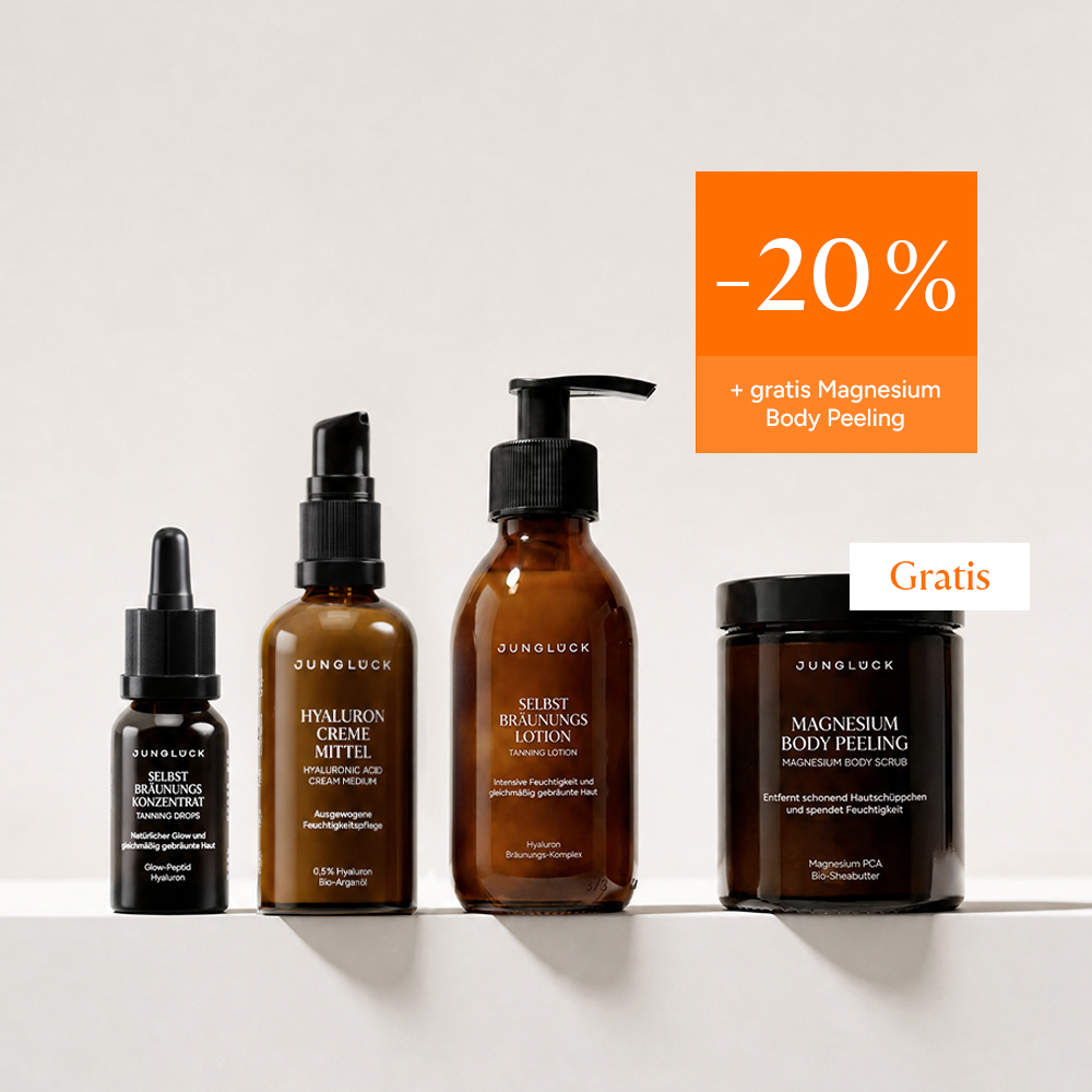 A lineup of four JUNGLUCK skincare products in amber glass containers against a light background with a promotional offer.