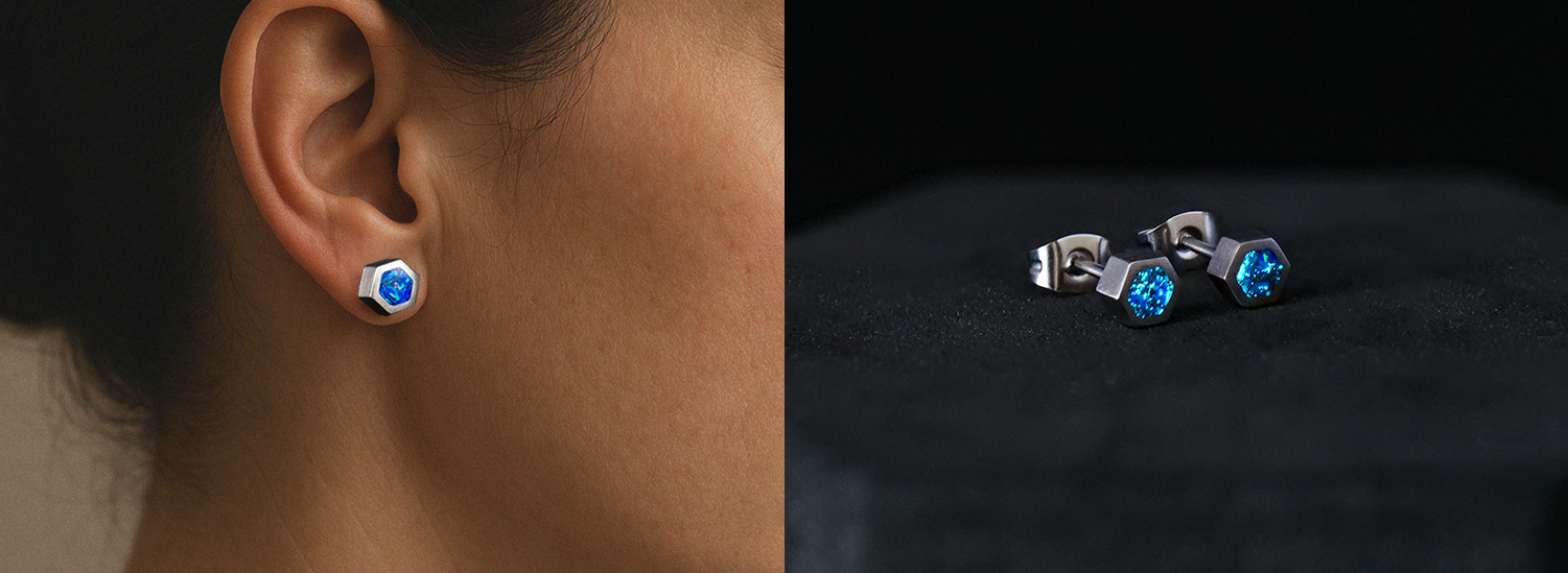 A split image showing a person wearing a hexagonal blue earring and a pair on a black surface.