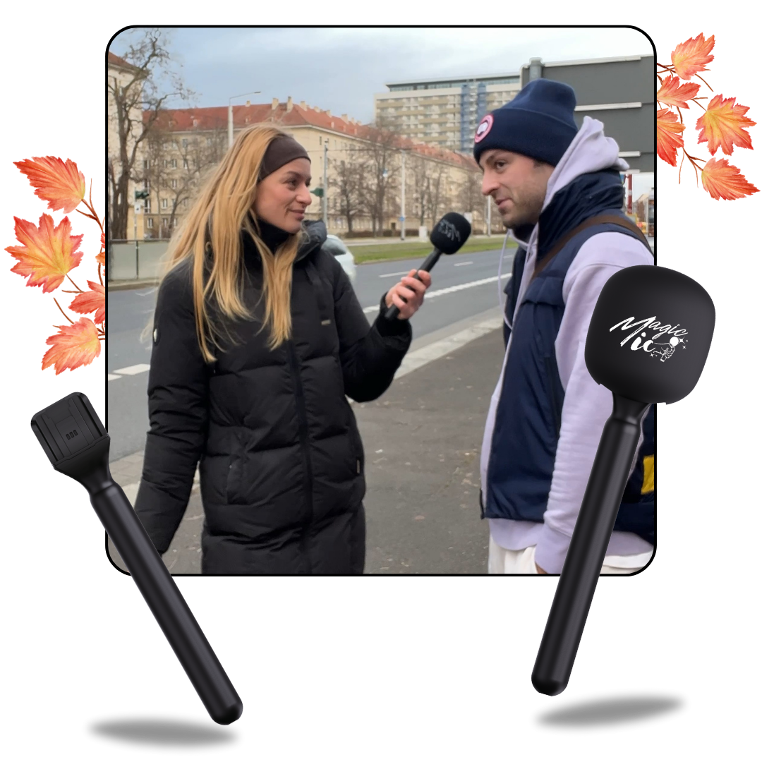Woman interviewing a man on a city street with microphones.