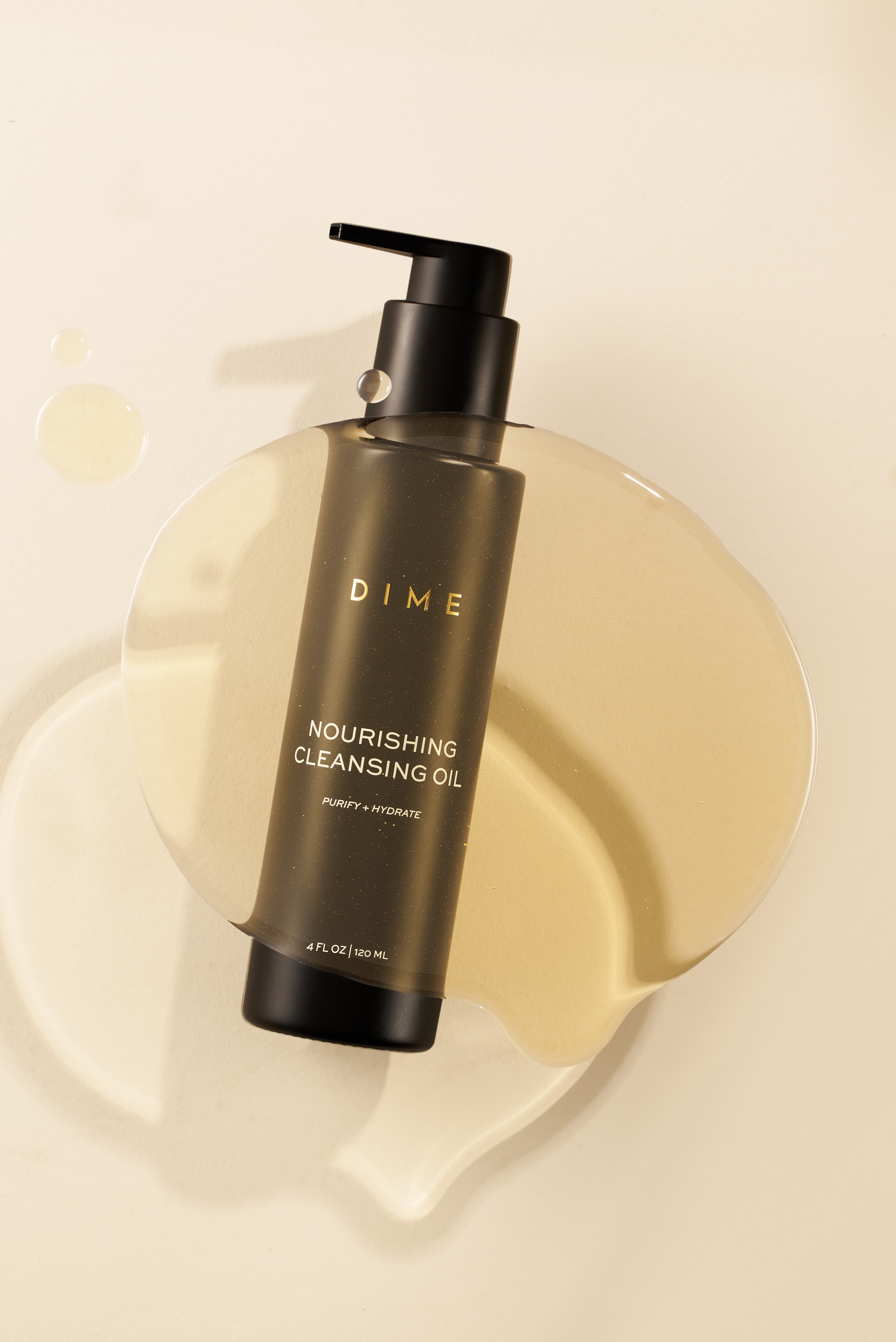 Two brown pump bottles on a draped fabric surface.