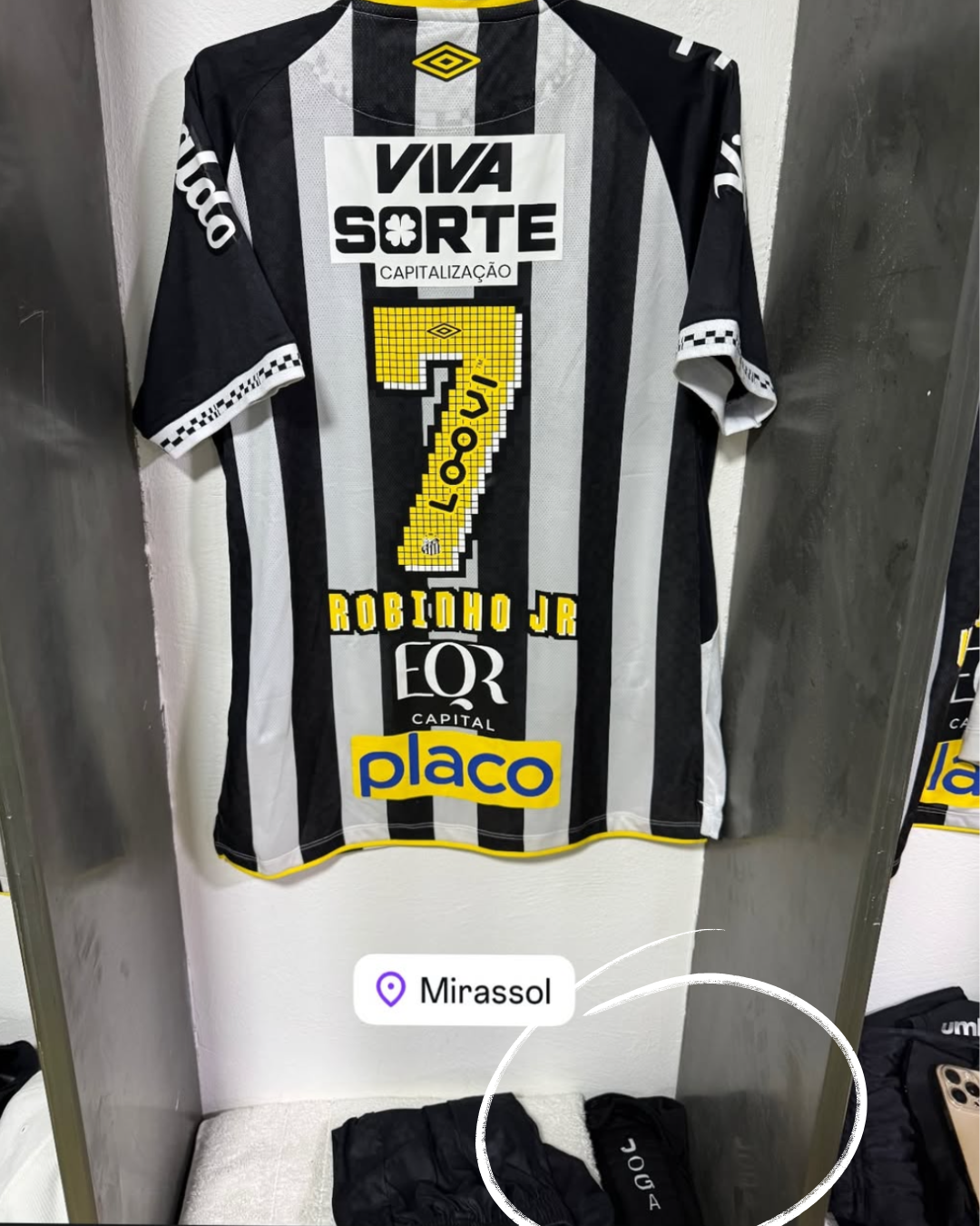 Black and white striped soccer jersey with number 7, 'Robinho Jr' and various logos.