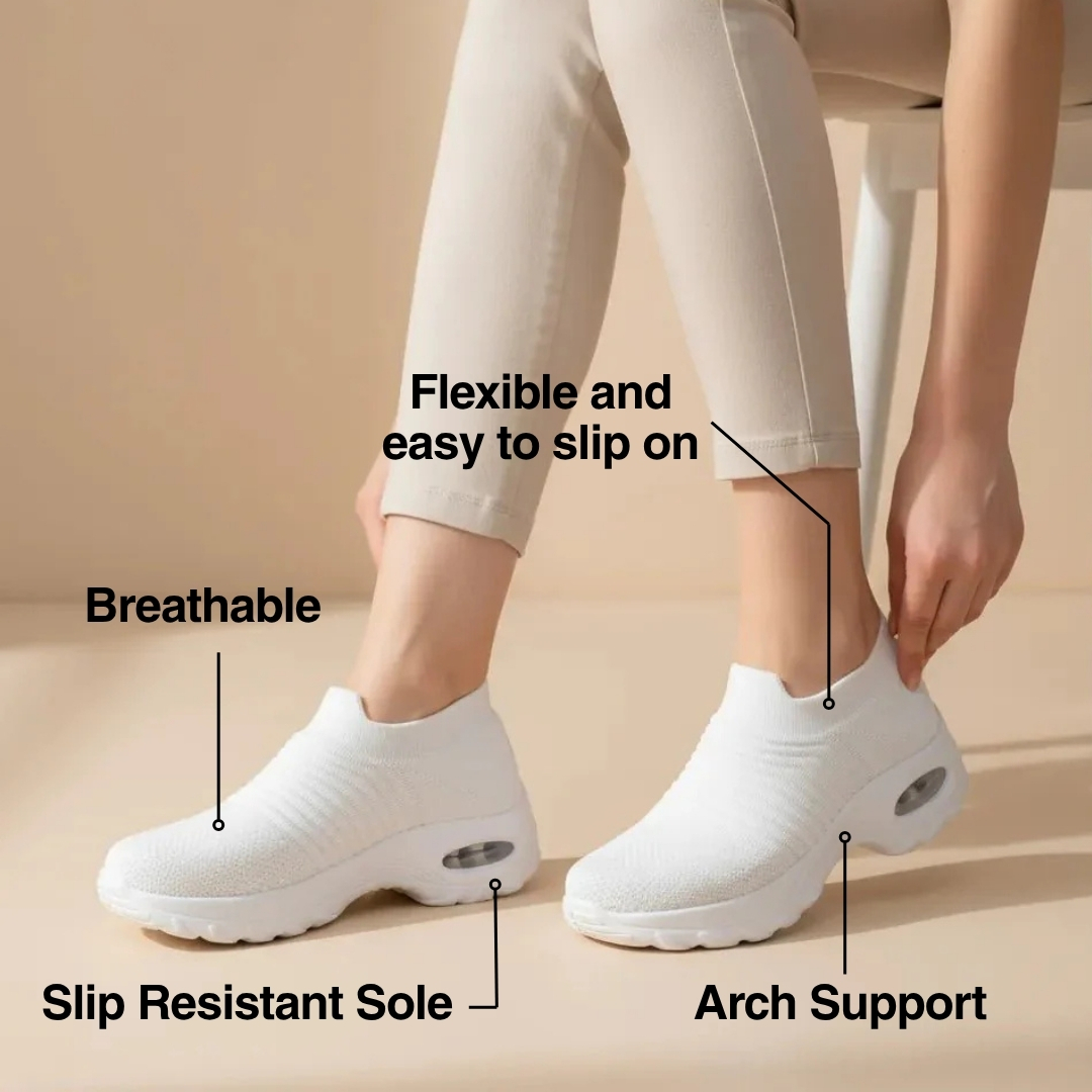 White slip-on shoes with labels: breathable, slip resistant sole, arch support, flexible.