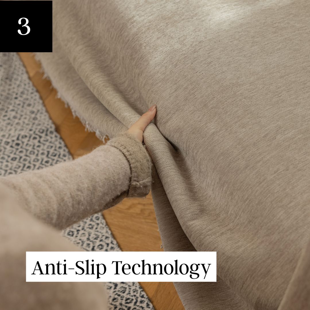 Person adjusting gray fabric on a wooden floor.