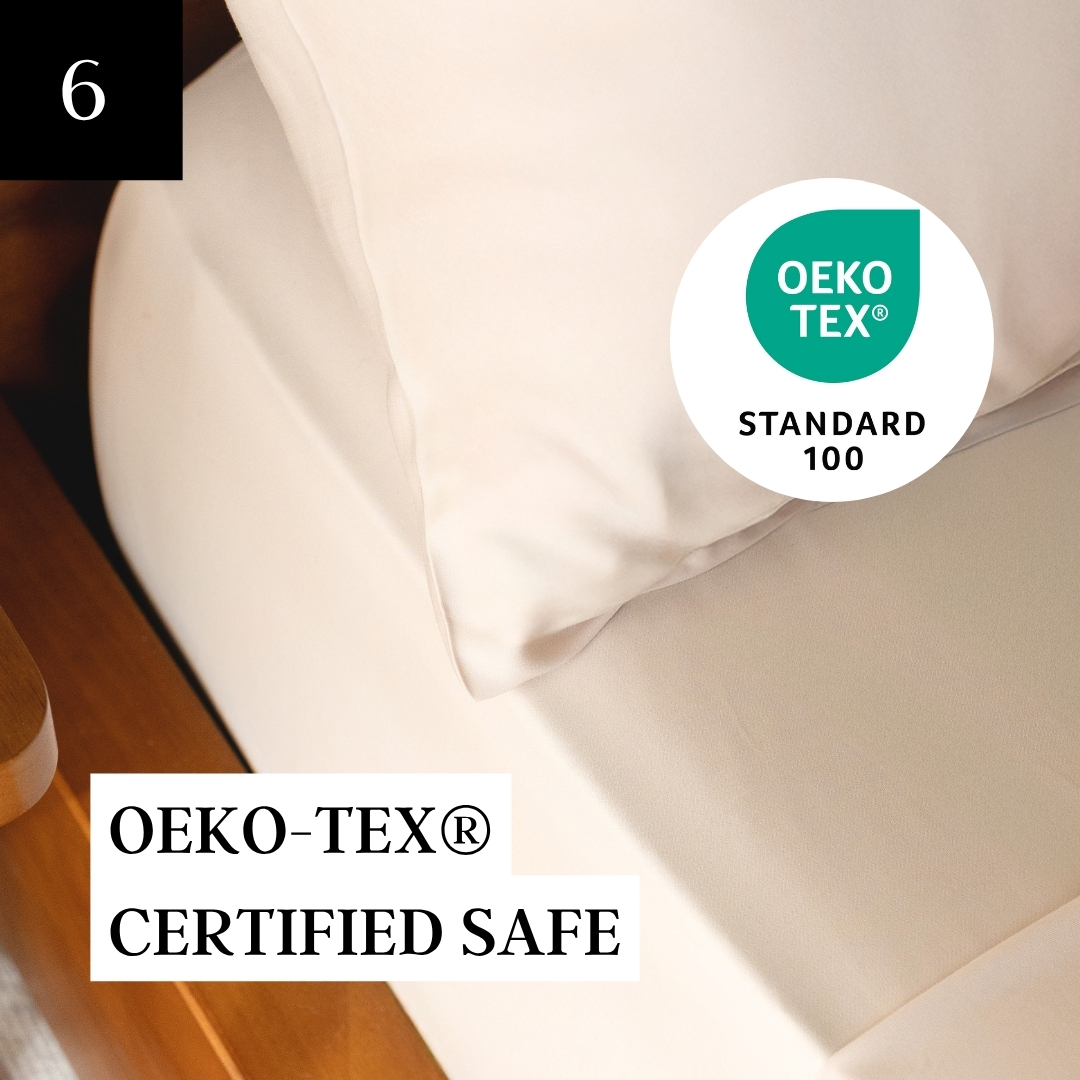 Cream-colored bedding with a book titled 'Minimalista' and Oeko-Tex certification logos.