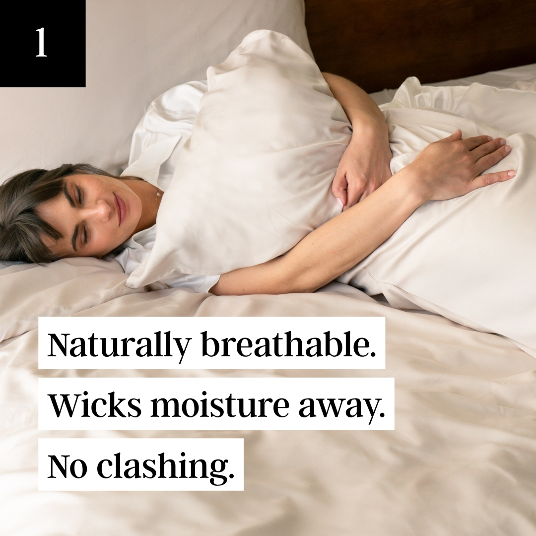 A woman with her eyes closed rests peacefully in bed, hugging a pillow to her chest.