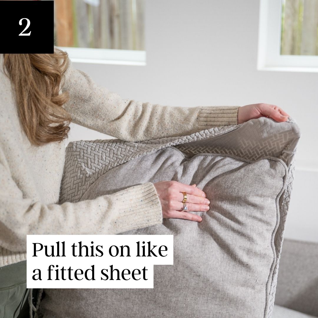 A dog's muddy paw prints on a light-colored sofa, with text and a graphic promoting sofa protection.