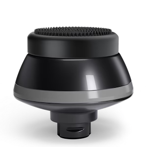 Black and gray round device with a textured top and reflective surface.