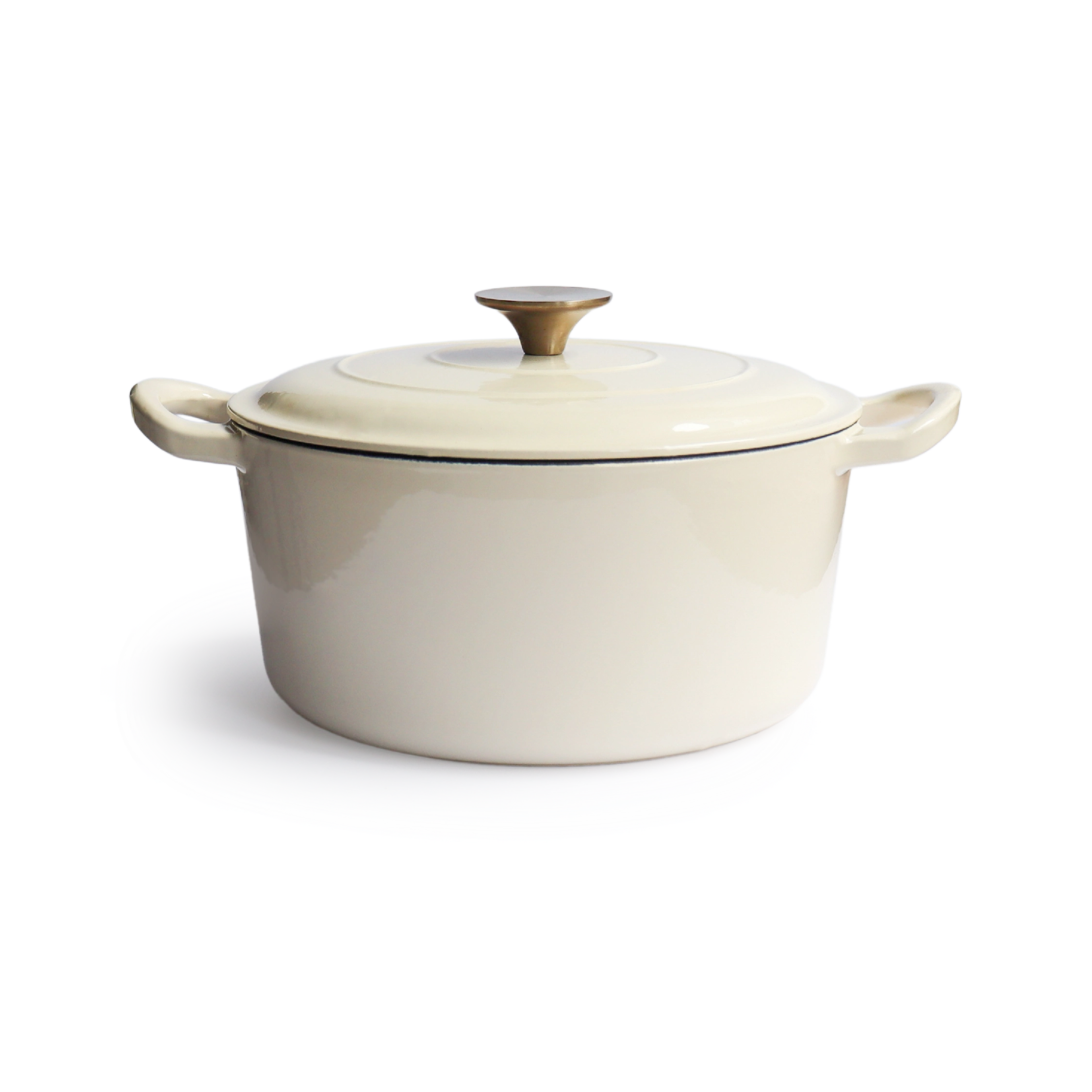 A cream-colored enameled Dutch oven with a lid and a brass knob on a white background.