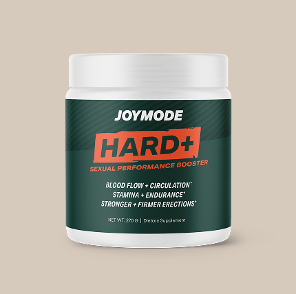 A white tub of Joymode Hard+ Sexual Performance Booster dietary supplement against a light brown background.