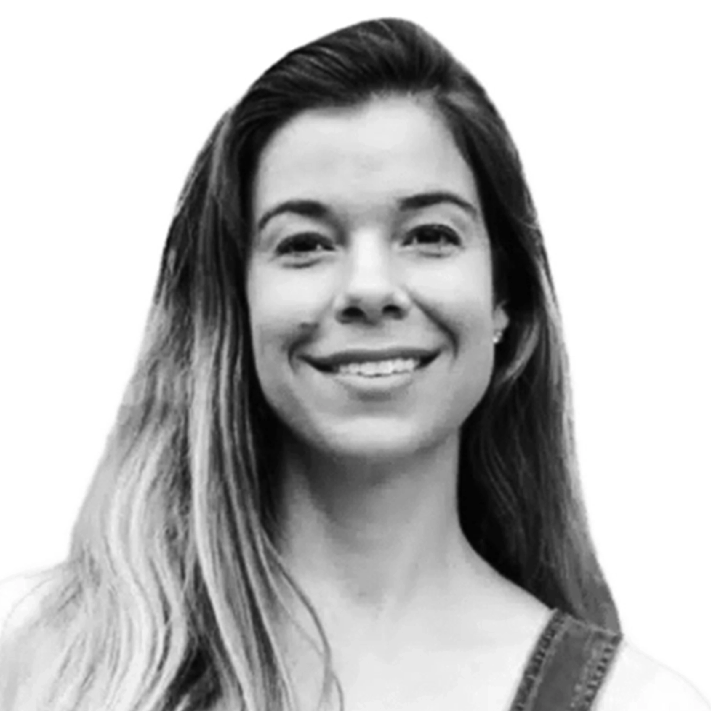 Black and white portrait of a smiling person with long hair.