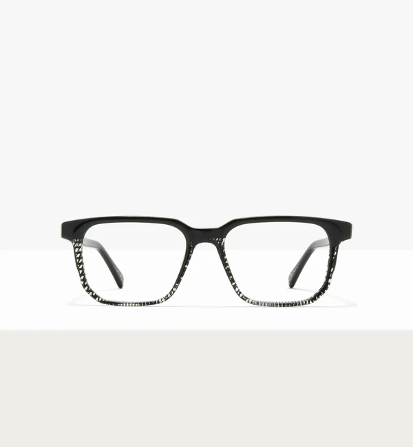 A front view of black rectangular eyeglasses with a patterned design on the lower rims.