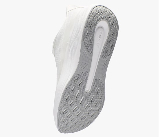 Bottom view of a white sneaker with textured sole.