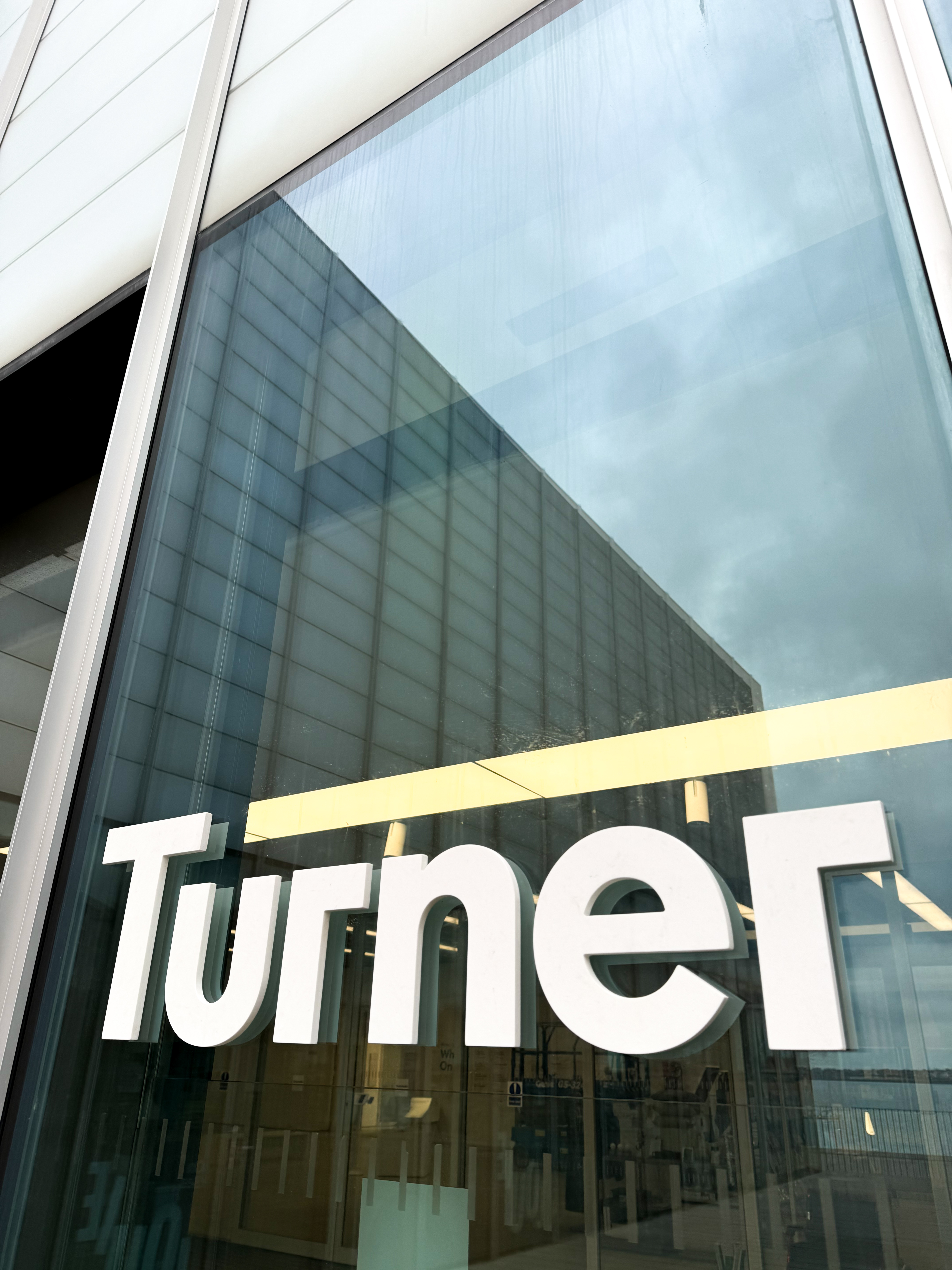 A marble-patterned keychain with embossed 'aws' logo on a white background.