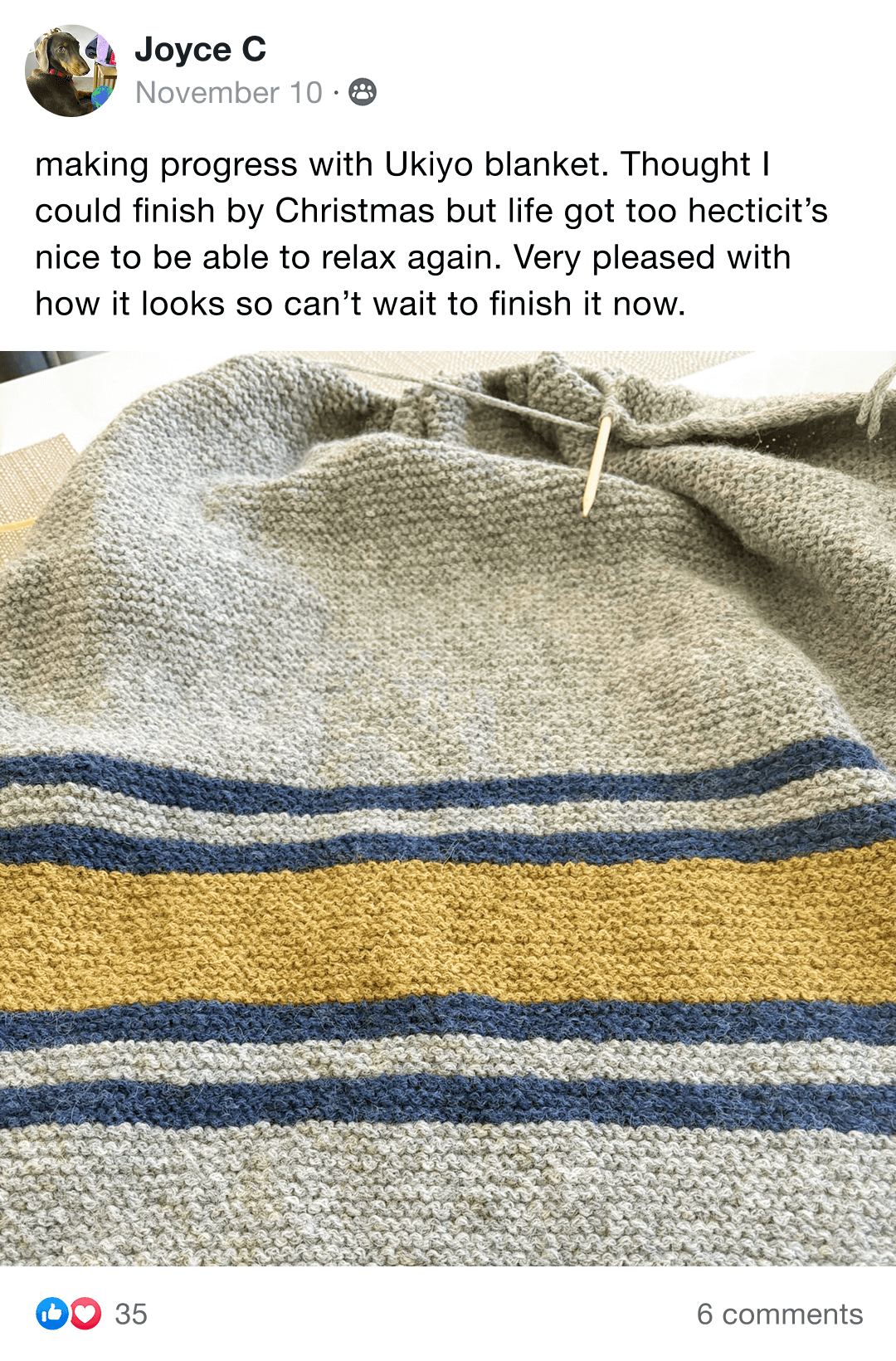 Handmade knitted blanket with brown, gray, and cream sections on a chair.