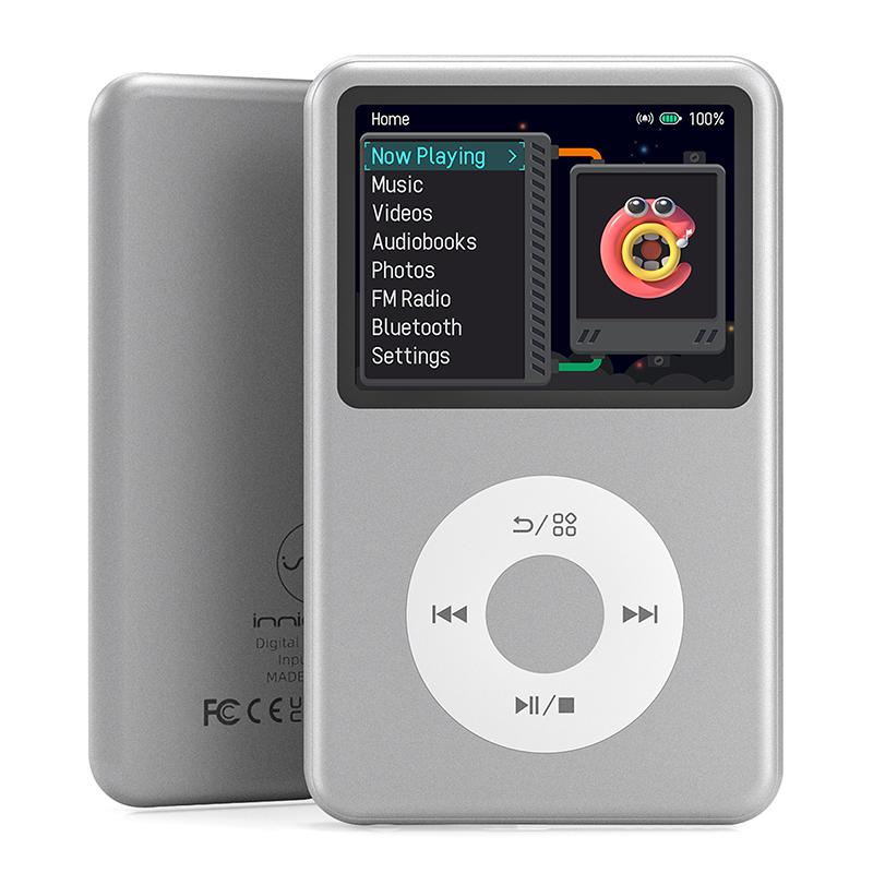 A silver portable digital music player with a screen and a circular control pad, shown from the front and back.