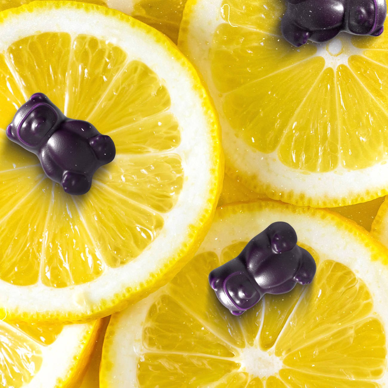 Purple gummy bears on sliced lemons.
