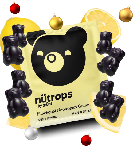 Gummy bear candy packaging surrounded by gummy bears and lemon slices.