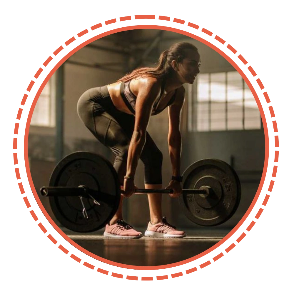 Person lifting a barbell in a gym setting.