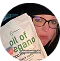 Person holding a package labeled 'oil of oregano.'