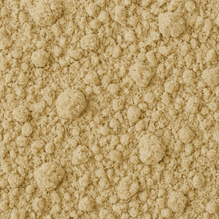 Close-up view of coarse beige powder with uneven texture.
