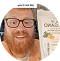 Person with glasses holding a package.