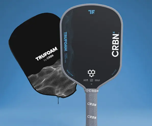 A black CRBN pickleball paddle and its matching TRUFOAM cover against a blue background.