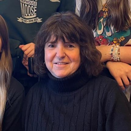 A black and white circular headshot
