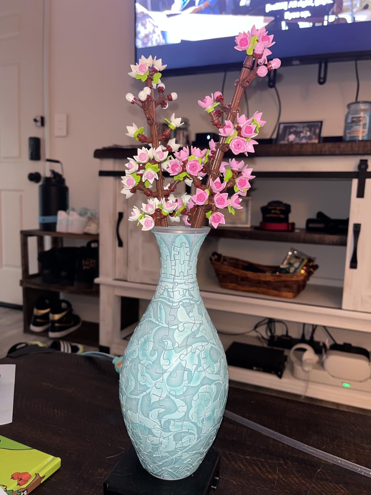 PieceRelax blue puzzle vase displaying pink cherry blossom building set branches