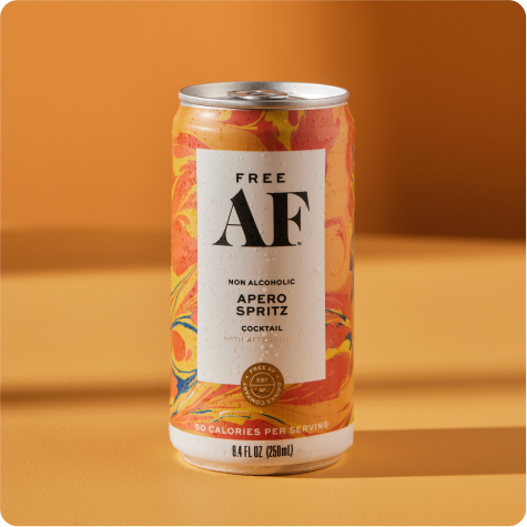 A can of Free AF non-alcoholic Apero Spritz cocktail on an orange background.