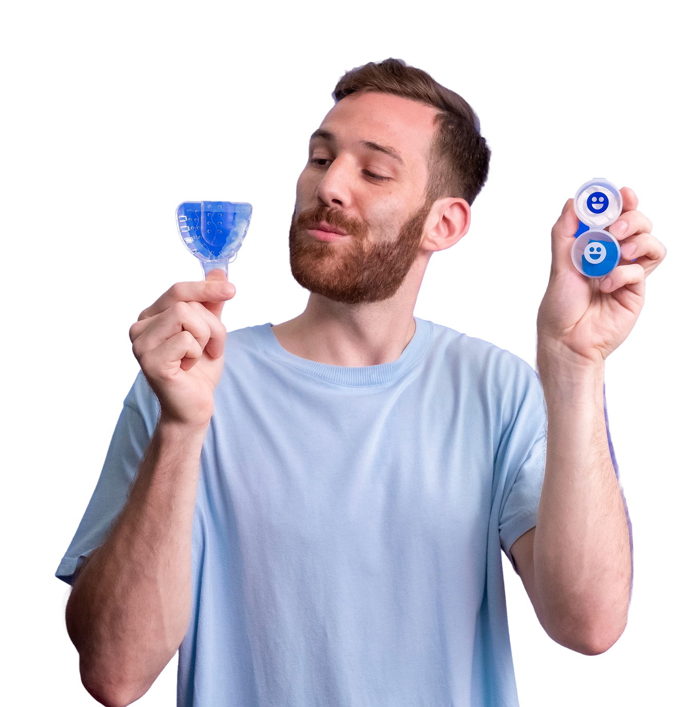Person holding a dental impression tray and contact lens case.