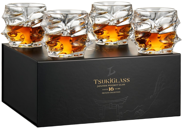 Four whiskey glasses with amber liquid on a black Tsukiglass box.