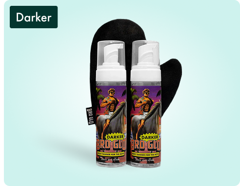 Two bottles of tanning foam with an applicator mitt next to them.