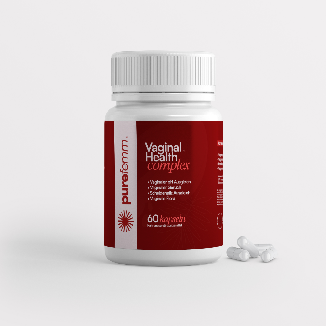White bottle labeled 'Vaginal Health Complex' with scattered capsules beside it.