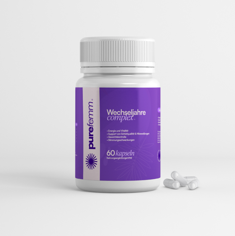 A white bottle of purefemm Wechseljahre complex with a purple label, with a few capsules spilled beside it.