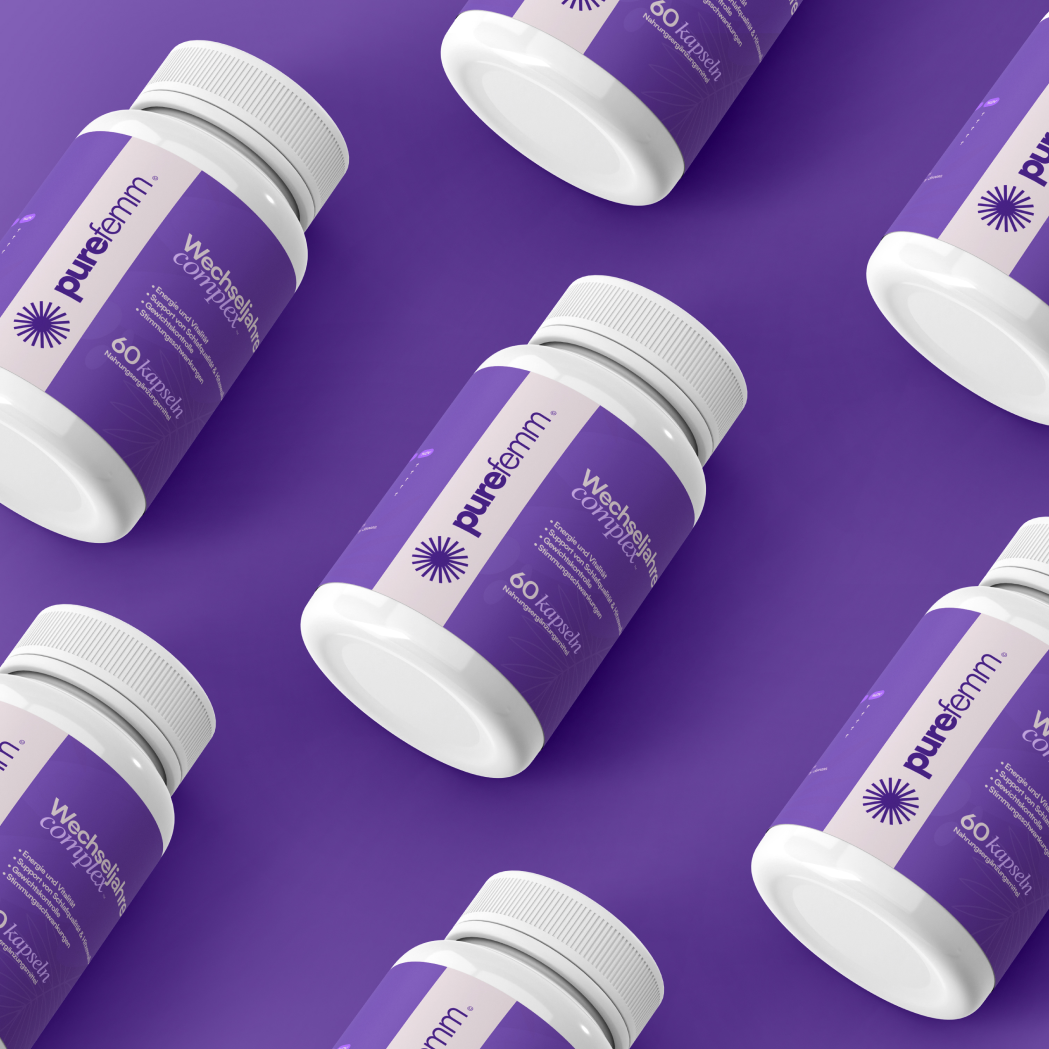 Multiple white bottles of purefemm. supplements with purple labels arranged on a solid purple background.