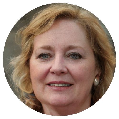 Portrait of a smiling person with blonde hair and earrings.