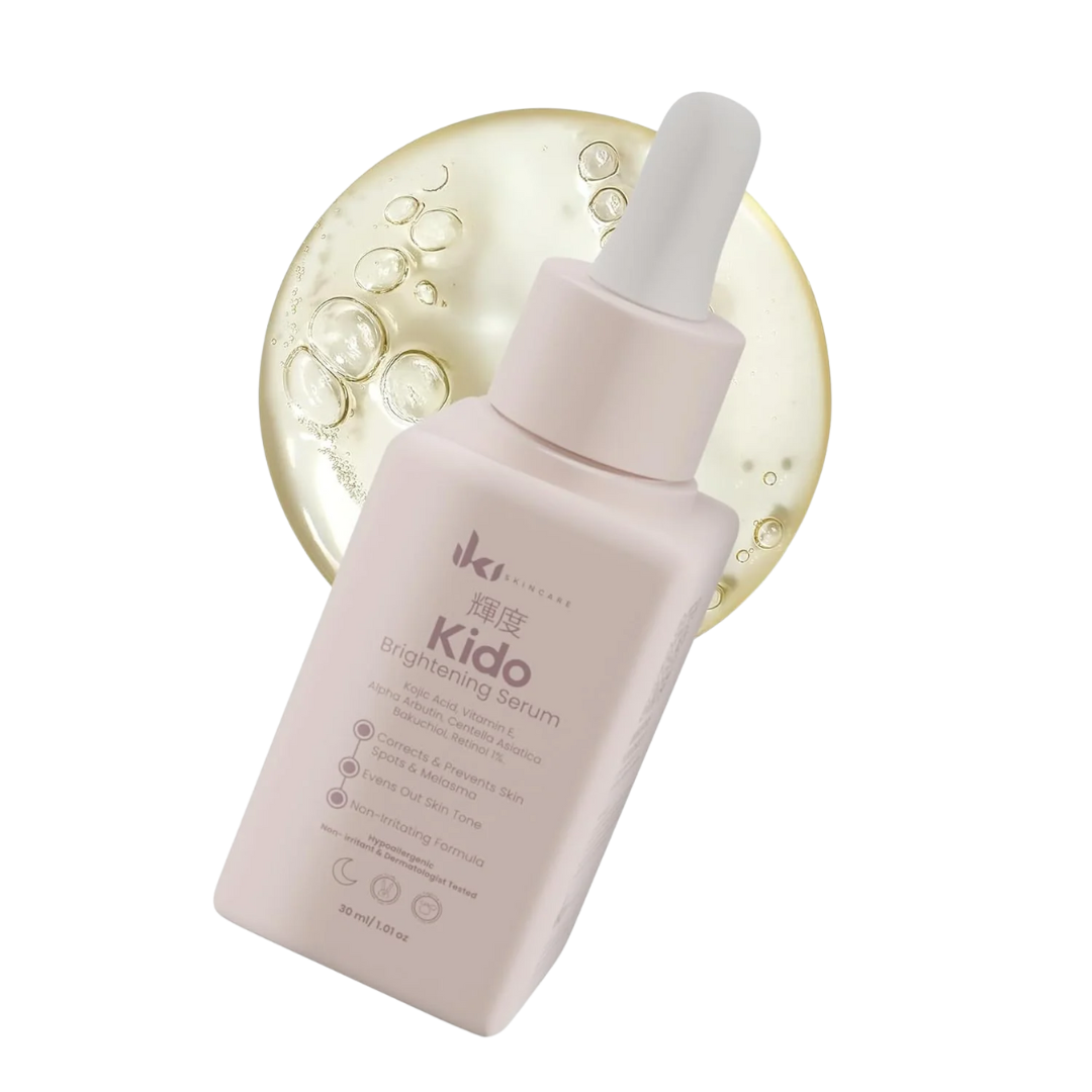 White lotion bottle with a pump next to green plant leaves on a geometric background.