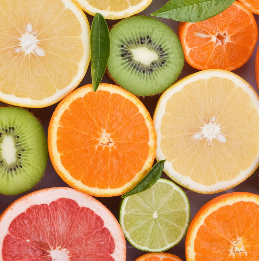 Person with headband applying facial foam, smiling.