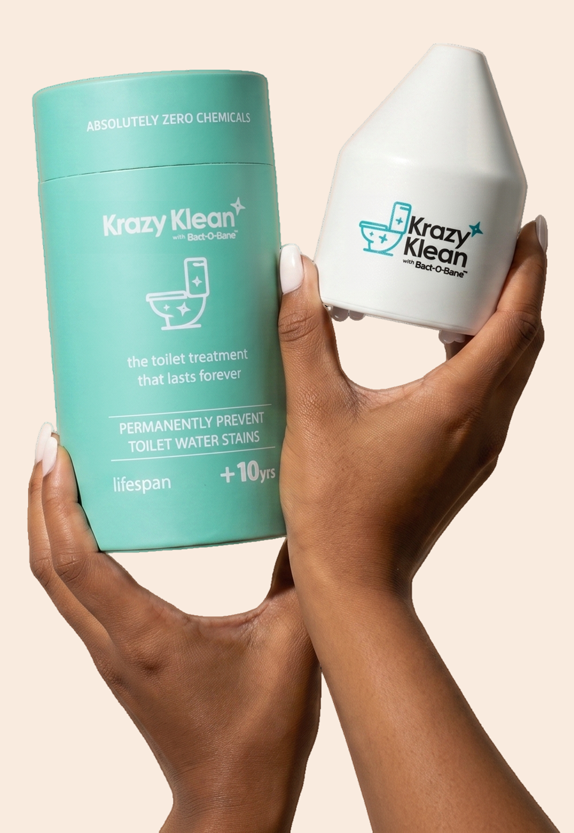 A pair of hands holding the Krazy Klean toilet treatment product and its teal cylindrical packaging.