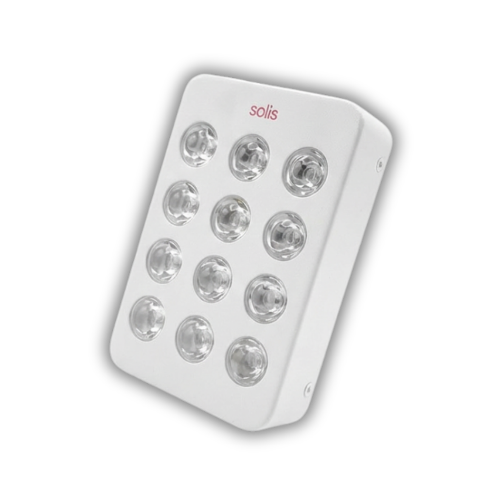 A white, rectangular Solis light therapy device with twelve circular bulbs, shown at an angle.